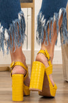 Strappy Heeled Sandals by Mi.iM  A chunky heel gives off retro vibes for on-trend dressing. Last but not least, a wrap-around ankle wrap looks just as stylish while providing wearable stability to this sky high design. Mustard Man-made Upper Padded footbed  Contact us for any additional measurements or sizing. 