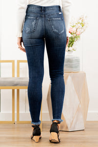 KanCan Jeans Collection: Spring 2021 Color: Dark Wash Distressed Fray Hem Cut: Skinny, 28.5" Inseam Rise: High-Rise, 10.5" Front Rise COTTON 94.3% T400 4.9% SPANDEX 0.8% Stitching: Classic Fly: Exposed Button Fly  Style #: KC7310D Contact us for any additional measurements or sizing.  Chloe is 5’8" and 130 pounds. She wears a size 3 in jeans, a small top, and 8.5 in shoes. She is wearing a size 25/3 in these jeans.