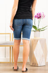 KanCan Maternity Jeans  Collection: Spring 2021 Color: Dark Wash Cut: Bermuda Length Shorts, 11.5" Inseam Rise: Low-Rise with Stretch Band, 5.5" Material: COTTON 92% POLYESTER 6% SPANDEX 2% Style #: KC6362D Contact us for any sizing questions or measurements.