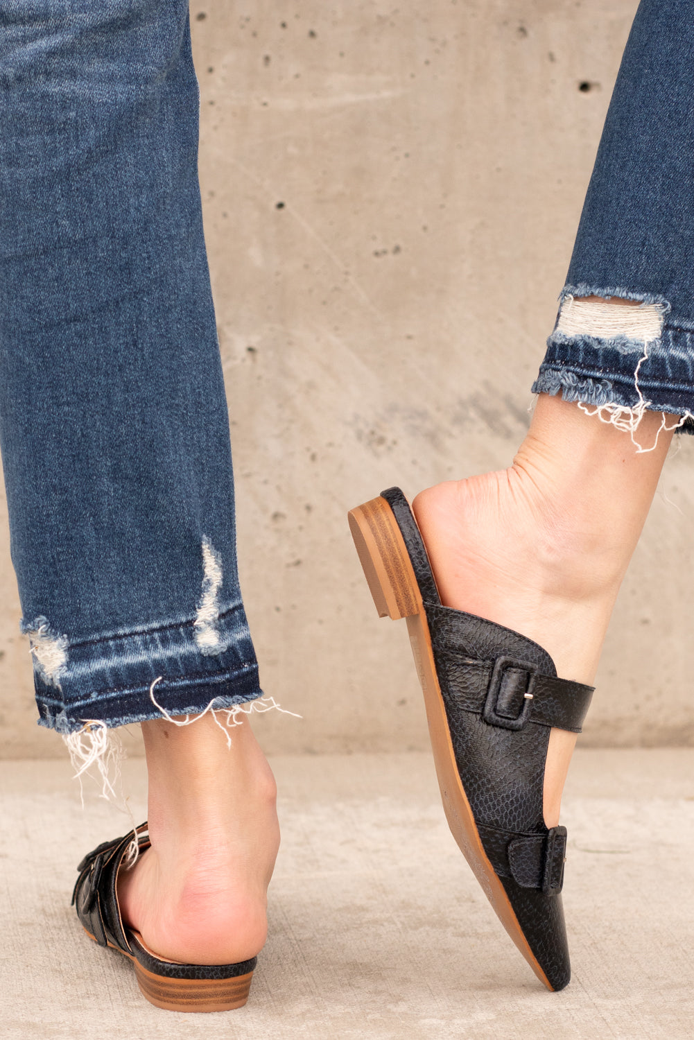 Flats by Mi.iM This creative slip on loafer adds a perfect amount of prep to any outfit! Buckles on the front give this slip on a fun pop of shine. Color: Navy Style Name: Hannah Man-made Leather Upper Genuine leather insole Heel Height: .5" Contact us for any additional measurements or sizing. 