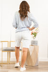 KanCan Jeans Take me back and make it better. These shorts feature a ripped over knee 90s style boyfriend fit with low to no stretch. Pair with your favorite graphics tee and sneakers for a comfortable throwback look! Collection: Spring 2021 Color: Light Blue Shorts Cut: Shorts, 9" Inseam Rise: High Rise, 11.5" Front Rise Material: 100% Cotton  Stitching: Classic Fly: Zip Style #: KC7841L Contact us for any additional measurements or sizing.