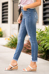 KanCan Jeans    These high rise medium blue wash skinny jeans have a destroyed fray hem and an exposed button fly. Dress these jeans up with heels and a cute tank! KanCan Stretch Level: Comfort Stretch     Color: Medium Blue Cut: Skinny, 27" Inseam Rise: High-Rise, 10.5" Front Rise 82.5% COTTON, 11.5% GRACELL, 4.5% POLYESTER, 1.5% SPANDEX Stitching: Classic  Fly: Zipper Style #: KC7136M Contact us for any additional measurements or sizing.