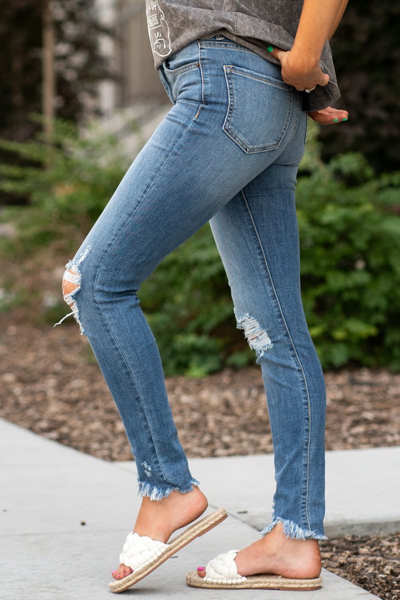 Sneak Peek Denim  These sneak peek jeans have an amazing high-rise skinny fit.  Collection: Spring 2021 Tomboy Skinny Color: Medium Blue Cut: Flares, 29" Inseam Rise: Mid-Rise, 10.5" Front Rise 71% Cotton 15% Rayon 12% Polyester 2% Spandex Fly: Zipper   Style #: SP-P11439 Contact us for any additional measurements or sizing.