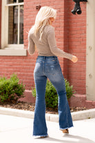 KanCan Jeans  These curvy-fit high-rise flares will be your fall must-have style. Pair with an oversized blouse for a boho-chic look.   Curvy-Fit Flare, 34" Inseam   High Rise, 10.25" Front Rise Medium Blue Wash  73% COTTON , 25.6% POLYESTER , 1.4% SPANDEX Fly: Zipper Style #: KC70009M Contact us for any additional measurements or sizing.