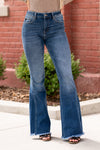 KanCan Jeans  These curvy-fit high-rise flares will be your fall must-have style. Pair with an oversized blouse for a boho-chic look.   Curvy-Fit Flare, 34" Inseam   High Rise, 10.25" Front Rise Medium Blue Wash  73% COTTON , 25.6% POLYESTER , 1.4% SPANDEX Fly: Zipper Style #: KC70009M Contact us for any additional measurements or sizing.