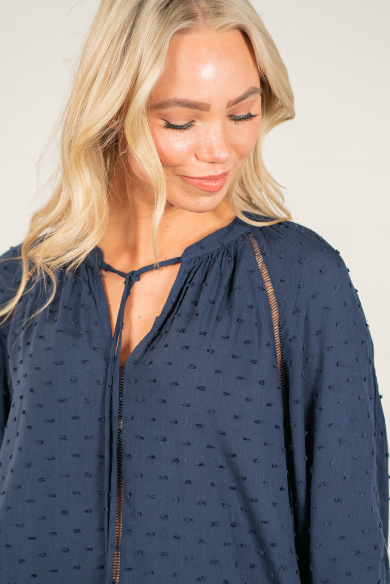 Blu Pepper Color: Navy Long Sleeves Swiss Dot Tie Neckline Lace Detail 100% Rayon Style #: TB6589   Contact us for any additional measurements or sizing.