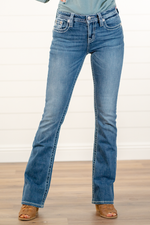 Miss Me  Wear these cross pockets jeans every day to bling up your wardrobe. Boot cut jeans featuring a 5 pocket design, whiskering, and crystal rivets. Wash: Dark Blue Inseam: 34" Bobot Cut* Mid Rise, 8.75" Front Rise* Silver Buttons and Rivets  Style #: M3742B3  Contact us for any additional measurements or sizing.    *Measured on the smallest size, measurements may vary by size.  