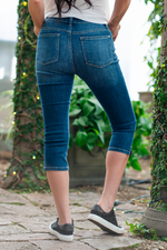 Judy Blue Color: Dark Blue Cut: Capris, 20" Inseam* Rise: Mid-Rise, 9.5" Front Rise* Machine Wash Separately In Cold Water Material: 66% Cotton / 21% Polyester / 11% Rayon / 2% Spandex Stitching: Classic Fly: Zipper  Style #: JB82274 | 82274   Contact us for any additional measurements or sizing.    *Measured on the smallest size, measurements may vary by size.