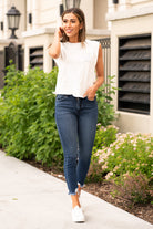 KanCan Jeans These high rise dark wash skinny jeans have a distressed fray hem and fit above the ankles so you can show off you sandals this summer. Color: Dark Blue Cut: Skinny, 27" Inseam Rise: High-Rise, 10" Front Rise 82.5% COTTON , 11.5% VISCOSE , 4.5% POLYESTER , 1.5% SPANDEX Stitching: Classic  Fly: Zipper Style #: KC7147D Contact us for any additional measurements or sizing.