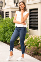 KanCan Jeans These high rise dark wash skinny jeans have a distressed fray hem and fit above the ankles so you can show off you sandals this summer. Color: Dark Blue Cut: Skinny, 27" Inseam Rise: High-Rise, 10" Front Rise 82.5% COTTON , 11.5% VISCOSE , 4.5% POLYESTER , 1.5% SPANDEX Stitching: Classic  Fly: Zipper Style #: KC7147D Contact us for any additional measurements or sizing.