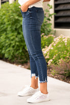 KanCan Jeans These high rise dark wash skinny jeans have a distressed fray hem and fit above the ankles so you can show off you sandals this summer. Color: Dark Blue Cut: Skinny, 27" Inseam Rise: High-Rise, 10" Front Rise 82.5% COTTON , 11.5% VISCOSE , 4.5% POLYESTER , 1.5% SPANDEX Stitching: Classic  Fly: Zipper Style #: KC7147D Contact us for any additional measurements or sizing.