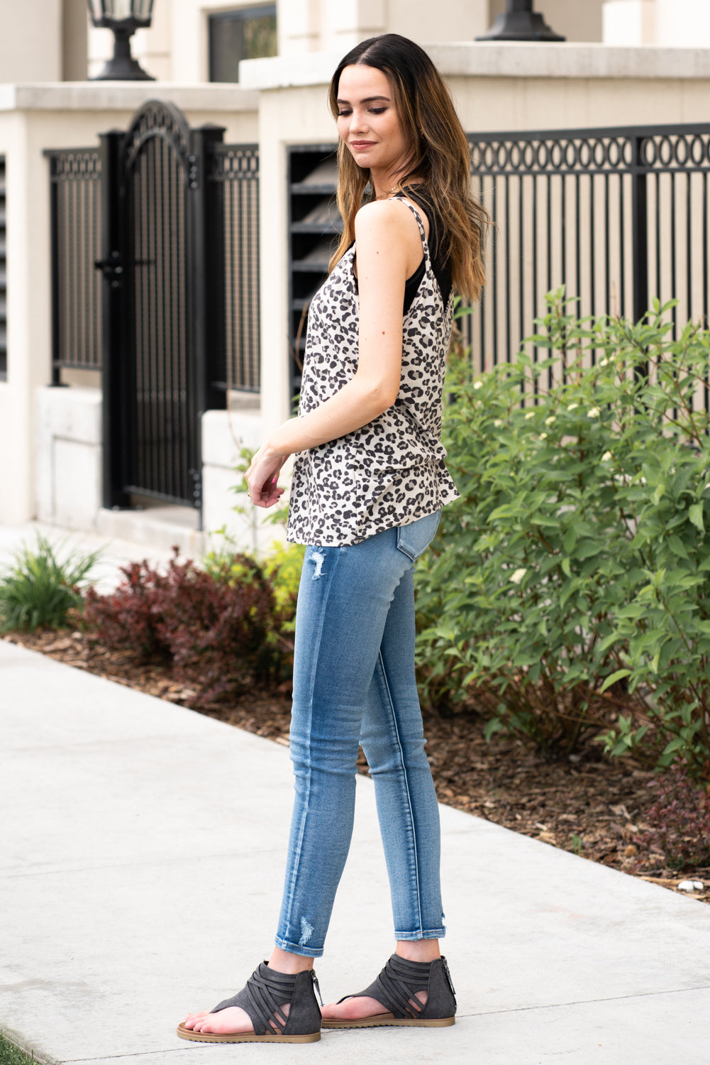 BiBi   Leopard printed tank. Pair this with denim or shorts and sandals for a cute summer look.  Collection: Spring 2021 Color: Leopard Tan Neckline: V-Neck Sleeve: Sleeveless Style #: BT1828A-18  Contact us for any additional measurements or sizing.  *Paired with the JoJo Henley Tank