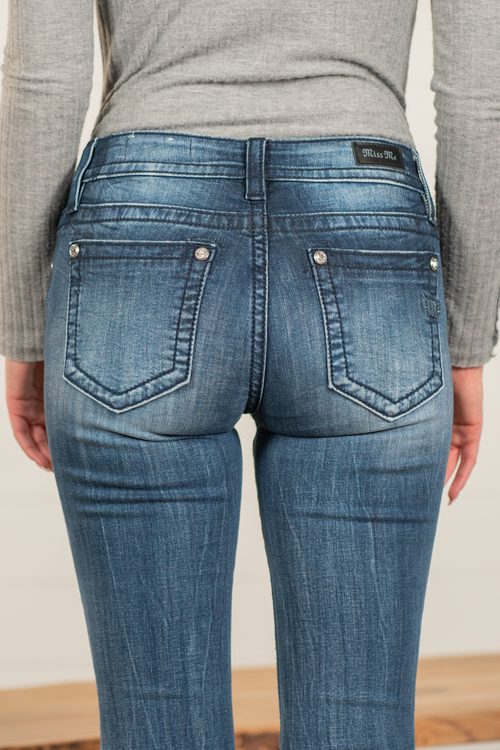 Miss Me  Stay in the spotlight with this adorable pair of skinny jeans detailed with an embroidered yoke. Wash: Med Blue Inseam: 30" Skinny Cut Mid Rise, 8.5" Front Rise Silver Buttons and Rivets Style #: M3636S36 Contact us for any additional measurements or sizing.  *Measured on the smallest size, measurements may vary by size. 