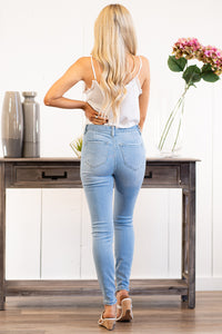 KanCan Jeans Collection: Spring 2021 Color: Light Blue Wash Destroyed Hem Ankle Cut: Skinny, 28" Inseam Rise: High-Rise, 11" Front Rise 94.9% COTTON, 3.8% POLYESTER, 1.3% SPANDEX Stitching: Classic Fly: Exposed Button Fly Style #: KC7337L Contact us for any additional measurements or sizing.  Haley wears a size small top, a 1 in jeans, and a small in tops. She is wearing a size 24/1 in these shorts.