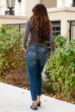 Judy Blue  These distressed boyfriend jeans will be your comfiest Judy Blues yet! With relaxed legs and a mid-waist, you will want to wear these every day!   Color: Dark Blue Cut: Boyfriend, 29" Inseam* Rise: Mid Rise. 9.5" Front Rise* Material: 91% COTTON,7% POLYESTER, 2% RAYON Machine Wash Separately In Cold Water Stitching: Classic Fly: Zipper Style #: JB88305 , 88305 Contact us for any additional measurements or sizing.   *Measured on the smallest size, measurements may vary by size. 