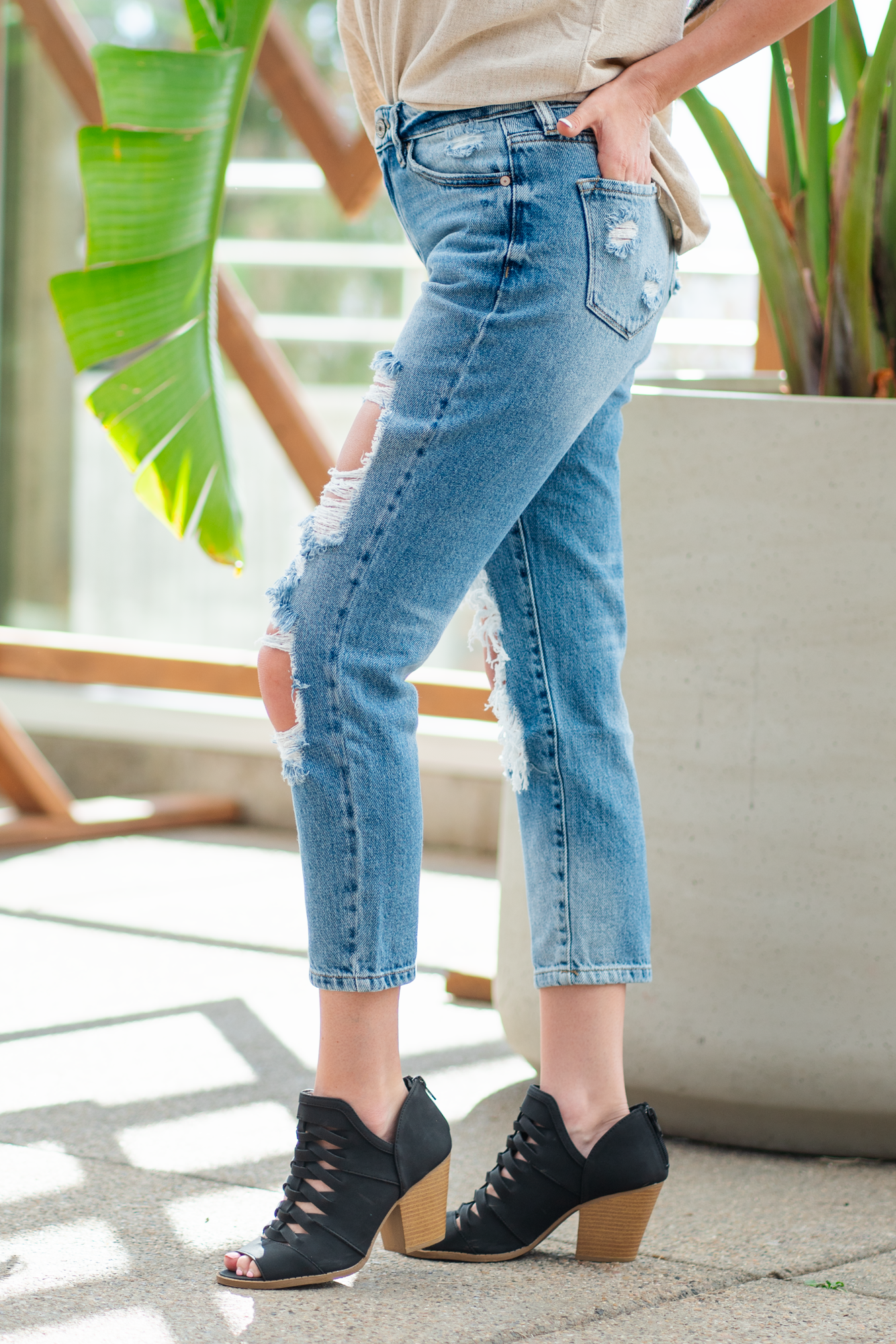 KanCan Jeans  These boyfriend jeans will become your new favorite look. Pair with a  tank and heels for a casual spring look. Color: Medium Blue Wash Cut: Straight Fit, 27" Inseam* Rise: Mid-Rise, 9.75" Front Rise* 94% COTTON, 5% POLYESTER, 1% SPANDEX Fly: Exposed Button Fly Style #: KC8571M Contact us for any additional measurements or sizing.  *Measured on the smallest size, measurements may vary by size.
