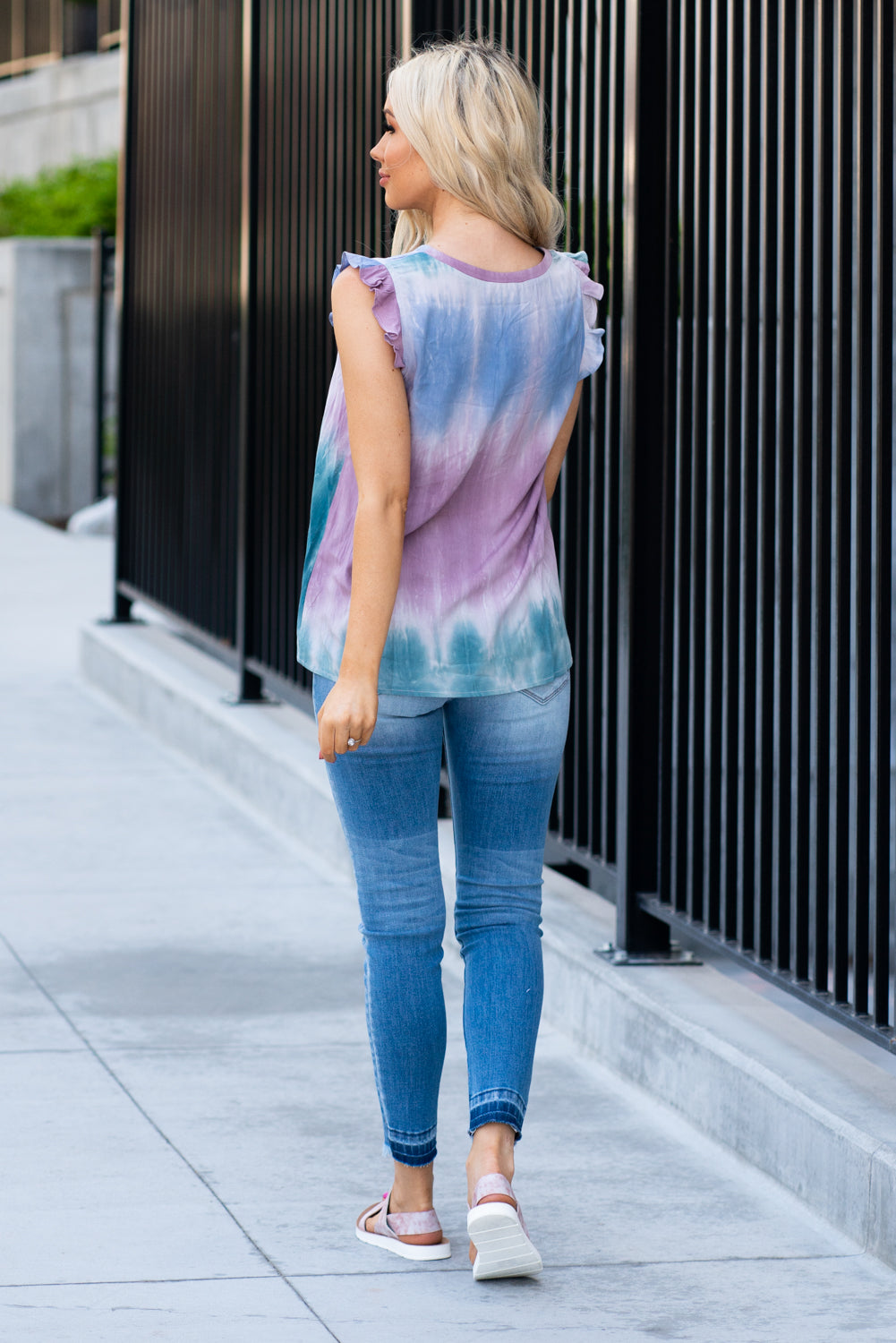 Mystree  This ruffle sleeve top is a fun way to add color to your summer wardrobe! Collection: Spring 2021 Color: Teal & Purple Neckline: V   Sleeve: Ruffled Sleeves 100% Rayon  Style #: 19309-Teal Contact us for any additional measurements or sizing.