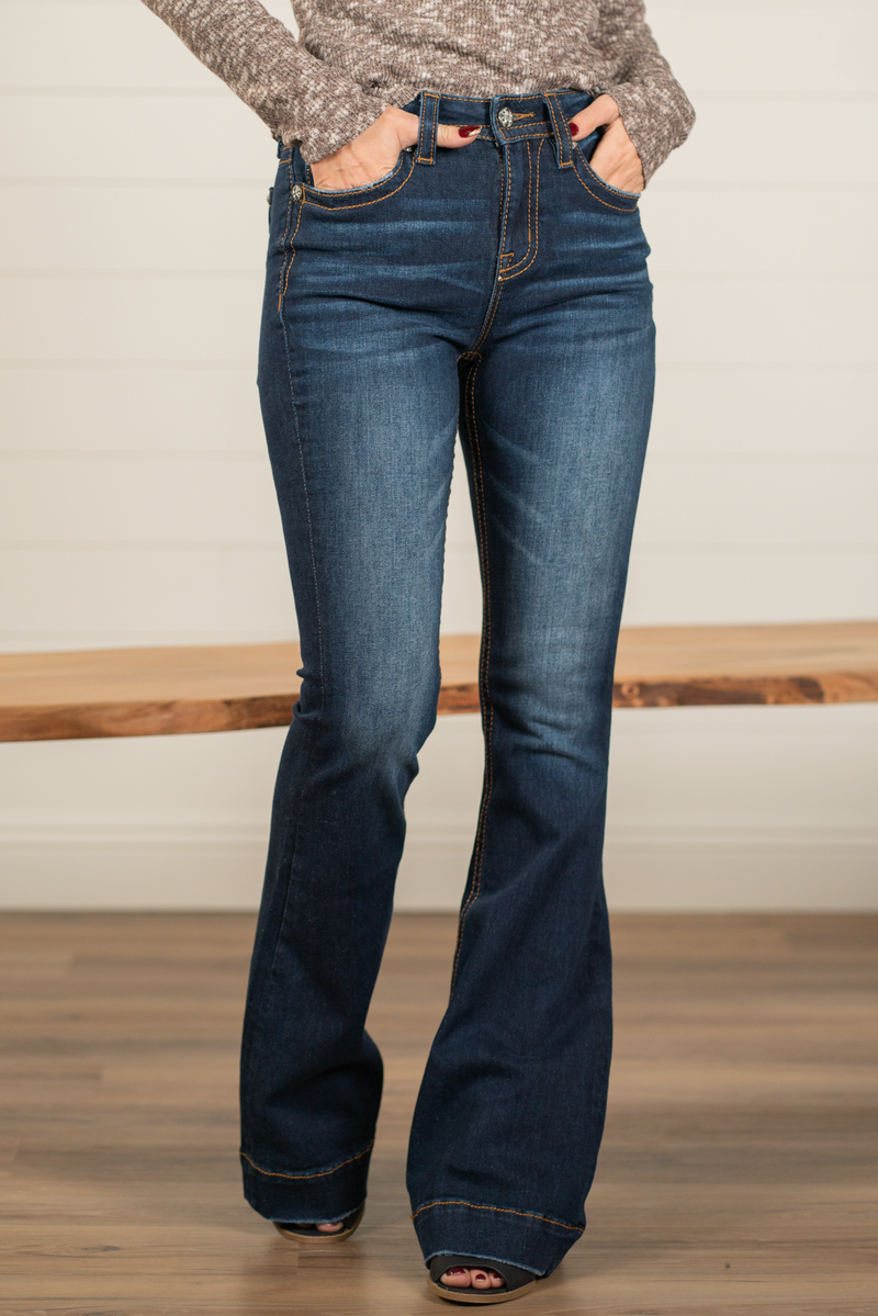 Miss Me  Wear these trouser hem flare cut jeans every day to bling up your wardrobe. Flare cut jeans featuring a 5 pocket design, whiskering, and crystal rivets. Wash: Dark Blue Inseam: 34" Flare Cut* Mid Rise, 8.75" Front Rise* Silver Buttons and Rivets  Style #: H3636F35 Contact us for any additional measurements or sizing.    *Measured on the smallest size, measurements may vary by size.  