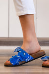 Double Bow Slides Sandals by KayKay  Pair with your favorite ankle skinny and t-shirt and you have the perfect combo for outside fun.  Style Name: Bow Slides  Color: Bandana Blue Cut: Block Slides Material. Outsole: Rubber Upper: Textile/Manmade  Contact us for any additional measurements or sizing.