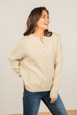 Miss Sparkling  Layer up this henley with skinny jeans and boots for a perfect winter look.   Color: Cream Neckline: Button Up Pull Over Sleeve: Long Style #: D20501113 Contact us for any additional measurements or sizing.  