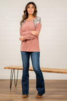 BiBi   Throw on for an easy casual look with your favorite jeans this fall.   Color: Marsala   Neckline: Round Sleeve: Long Style #: BT1865 Contact us for any additional measurements or sizing.       