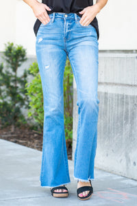 VERVET by Flying Monkey Jeans  This mid-rise flare from VERVET has a cute slanted hem and a soft stretchy material. Flare, 34" Inseam* Rise: Mid Rise, 9.25" Front Rise* 65% COTTON, 30% POLYESTER, 3% RAYON, 2% SPANDEX Stitching: Classic  Fly: Zip Fly Style #: T5311 Contact us for any additional measurements or sizing.    *Measured on the smallest size, measurements may vary by size. 