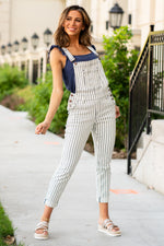 Judy Blue Jeans  Add some fun into your life with these cute striped boyfriend-fit overalls! Collection: Spring 2021 Color: Navy Blue Striped with Wite Cut: Boyfriend Overalls, 27" Inseam  Rise: 10" Front Rise 64.7% COTTON,21% RAYON,12.9% polyester,1.4% SPANDEX Fly: Zipper Fly Style #: JB88222-White | 88222-WT Contact us for any additional measurements or sizing. 