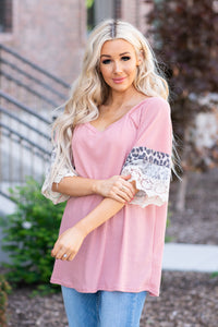 BiBi   Stay pretty in this casual ruffle sleeve top.  Collection: Spring 2021 Color: Pink Neckline: Round Neck Sleeve: Ruffle Sleeve   Style #: BT2354-01  Contact us for any additional measurements or sizing.  