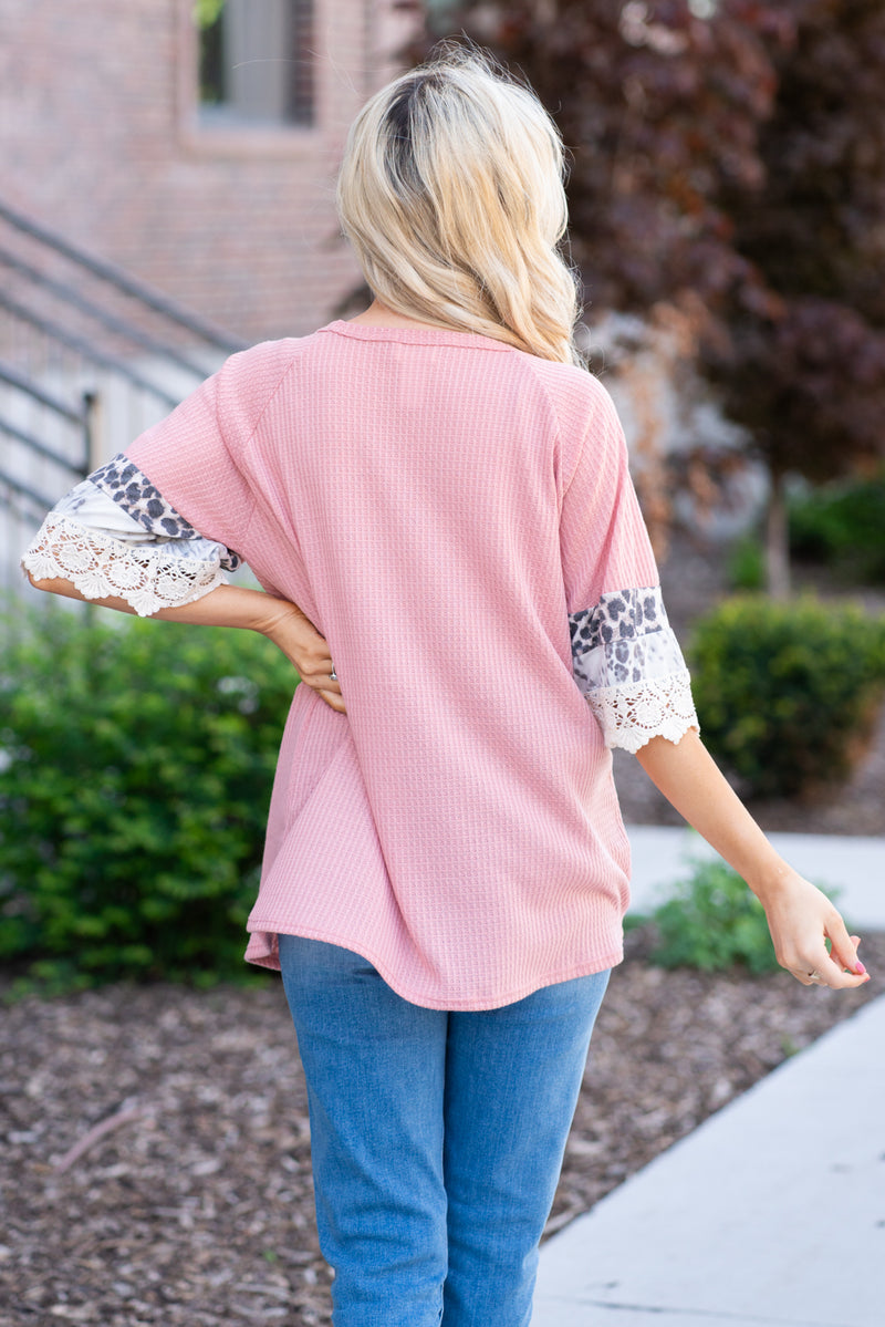 BiBi   Stay pretty in this casual ruffle sleeve top.  Collection: Spring 2021 Color: Pink Neckline: Round Neck Sleeve: Ruffle Sleeve   Style #: BT2354-01  Contact us for any additional measurements or sizing.  