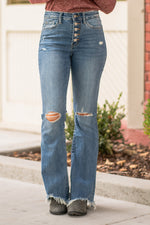 VERVET by Flying Monkey Jeans  Comfort-stretch denim, high rise waist, bell-bottom style, button fly closure, whiskering, destroyed hem, and grinding details. Skinny, 33" Inseam Rise: High Rise, 10" Front Rise 91% Cotton, 7% Polyester, 2% Spandex Stitching: Classic Fly: Zip Fly Style #: T5203 Contact us for any additional measurements or sizing.