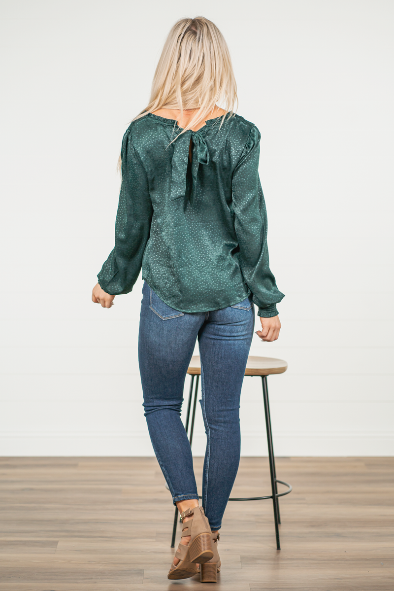 Blu Pepper Color: Hunter Green Long Sleeve Round Neckline Back Tie SELF: 100% Polyester  Style #: CR1498 Contact us for any additional measurements or sizing.