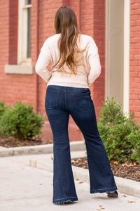 KanCan Jeans  KanCan Stretchy  Flare, 33" Inseam* High Rise, 9.75" Front Rise* Dark Blue Wash  53.5% COTTON, 39.3% RAYON, 5.6% POLYESTER, 1.6% SPANDEX Fly: Zipper Style #: KC7394D Contact us for any additional measurements or sizing.  *Measured on the smallest size, measurements may vary by size.  