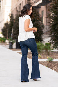 Hem & Thread   This peplum top has an oversized fit with a cross-over look. With a textured gauze material, you will feel comfortable and cute. Pair with your favorite jeans and booties for an early fall vibe.   Neckline: Round Sleeve: Short  69% POLYESTER 30% RAYON 1% SPANDEX Style #: 30868F-White Contact us for any additional measurements or sizing.
