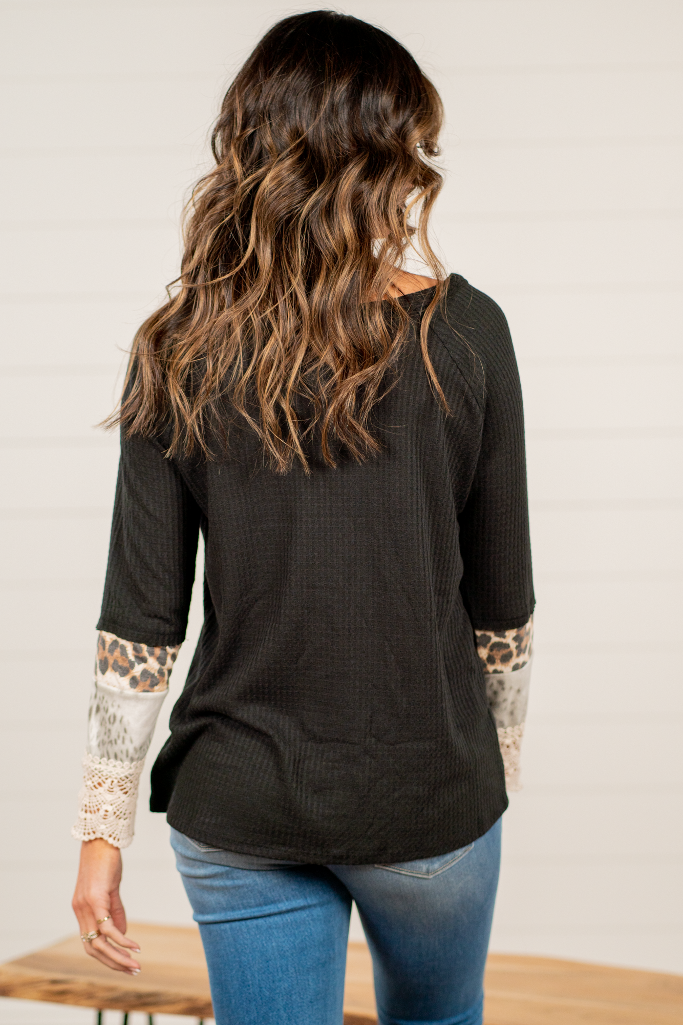 BiBi   Throw on for an easy casual look with your favorite jeans this fall.   Color: Black   Neckline: Round Sleeve: Long  Style #: BT2167 Contact us for any additional measurements or sizing.       