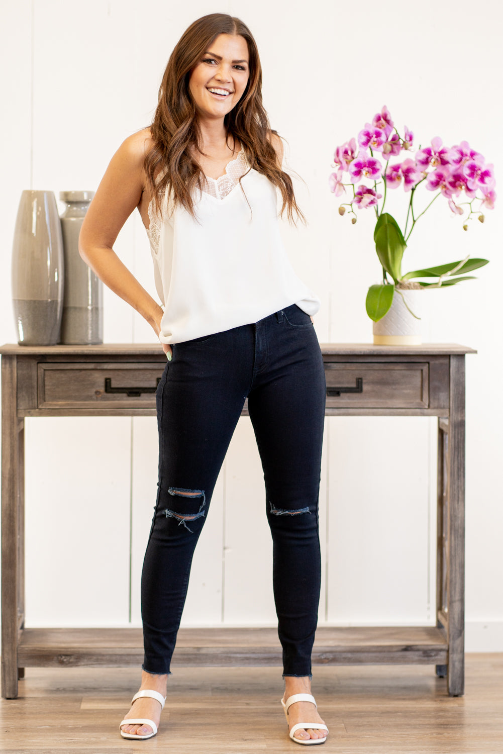Just USA Jeans  Color: Dark Blue Distressed Legs & Mini Frayed Hem Cut: Skinny, 27" Inseam Mid Rise, 9" Front Rise   Stitching: Classic 51% RAYON, 26% Rayon, 12% Polyester, 1% Lycra Fly: Zipper Style #: JP033-DK Contact us for any additional measurements or sizing.  Kristin wears a size small top, a 3 in jeans, and a 7 in shoes. She is wearing a size 4 in these jeans.