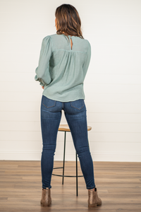 Blu Pepper Color: Minty Blue Long Sleeves Floral Embroidered Keyhole Back Sinched Wrists 86% RAYON 14% NYLON Style #: CR1476-Minty Blue Contact us for any additional measurements or sizing.