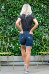 KanCan Jeans Color: Dark Wash Cuffed Mid Thigh Bermudas Cut: Mid Thigh Bermudas, 8.5" Inseam* Rise: Mid-Rise, 9" Front Rise* 64% Cotton, 21% Poly, 12% Rayon, 3% Spandex Stitching: Classic  Fly: Zipper Fly Style #: KC8578D Contact us for any additional measurements or sizing.  *Measured on the smallest size, measurements may vary by size. 