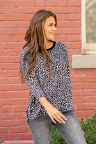 Hem & Thread   Feel comfortable and cute in this leopard knit top. Pair with your favorite jeans and booties for an early fall vibe.   Neckline: Round Neck Sleeve: Mid Length Style #: 31014F-Black Contact us for any additional measurements or sizing.   