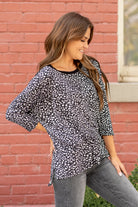 Hem & Thread   Feel comfortable and cute in this leopard knit top. Pair with your favorite jeans and booties for an early fall vibe.   Neckline: Round Neck Sleeve: Mid Length Style #: 31014F-Black Contact us for any additional measurements or sizing.   