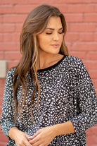 Hem & Thread   Feel comfortable and cute in this leopard knit top. Pair with your favorite jeans and booties for an early fall vibe.   Neckline: Round Neck Sleeve: Mid Length Style #: 31014F-Black Contact us for any additional measurements or sizing.   