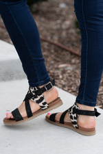 Strappy Sandal by Very G  These iconic boutique sandals from Very G are must have! Wear all spring/summer to add a little sass to your wardrobe. Style Name: Jayla Color: Black/Cream Cushioned foot bed Durable textured outsole Style #: VGSA0166-Black Contact us for any additional measurements or sizing.