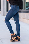 KanCan Jeans  Marinette is KanCans signature super skinny with a mid rise fit. These have a fitted leg with knee distressing and a whiskered wash in medium blue.  Color: Dark Wash Ankle Skinny, 30.5" Inseam* Mid Rise, 9.25" Front Rise* Distressed Knees 72% COTTON, 25% POLYESTER, 3% SPANDEX Fly: Zipper Style #: KC11237D Contact us for any additional measurements or sizing.    *Measured on the smallest size, measurements may vary by size. 