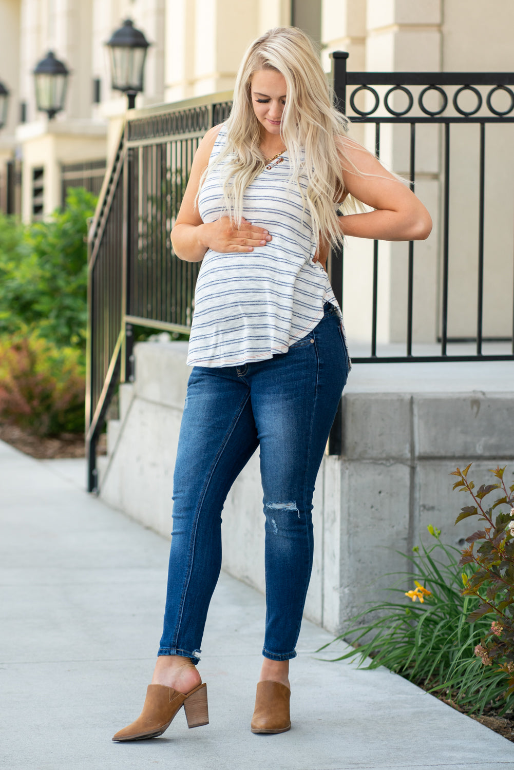 KanCan Maternity Jeans  Do you miss wearing jeans? These maternity jeans will keep you comfy and cute with an elastic stretch waistband that fits just under the tummy.   Color: Dark Wash Distressed Legs and Ankle Cut: Skinny, 27" Inseam Rise: Mid-Rise with Full Tummy Band, 5.5" Material: 94% COTTON, 4% T-400, 2% SPANDEX  Style #: KC3018M Contact us for any sizing questions or measurements.