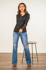 Miss Sparkling  Layer up this henley with skinny jeans and boots for a perfect winter look.   Color: Black Neckline: Button Up Henley Sleeve: Long Style #: O205059 Contact us for any additional measurements or sizing.  