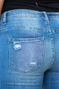 KanCan Maternity Jeans  Do you miss wearing jeans? These maternity jeans will keep you comfy and cute with an elastic stretch waistband that fits just under the tummy.   Color: Medium Wash Ripped Distressed Knee Released Hem Cut: Skinny, 29" Inseam Rise: Mid-Rise with Stretch Bands, 7.25" Material: 94% COTTON, 4% T-400, 2% SPANDEX Style #: KC3017M Contact us for any sizing questions or measurements.