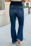 KanCan Maternity Jeans  Do you miss wearing jeans? These maternity jeans will keep you comfy and cute with an elastic stretch waistband that fits over the tummy.   Color: Dark Blue Wash Ripped Distressed Denim Patched Legs Fray Hem Detail Cut: Flare, 30" Inseam Rise: Mid-Rise with Full Tummy Band, 5.5" Material: 94% COTTON, 4% T-400, 2% SPANDEX Style #: KC3014D Contact us for any sizing questions or measurements.