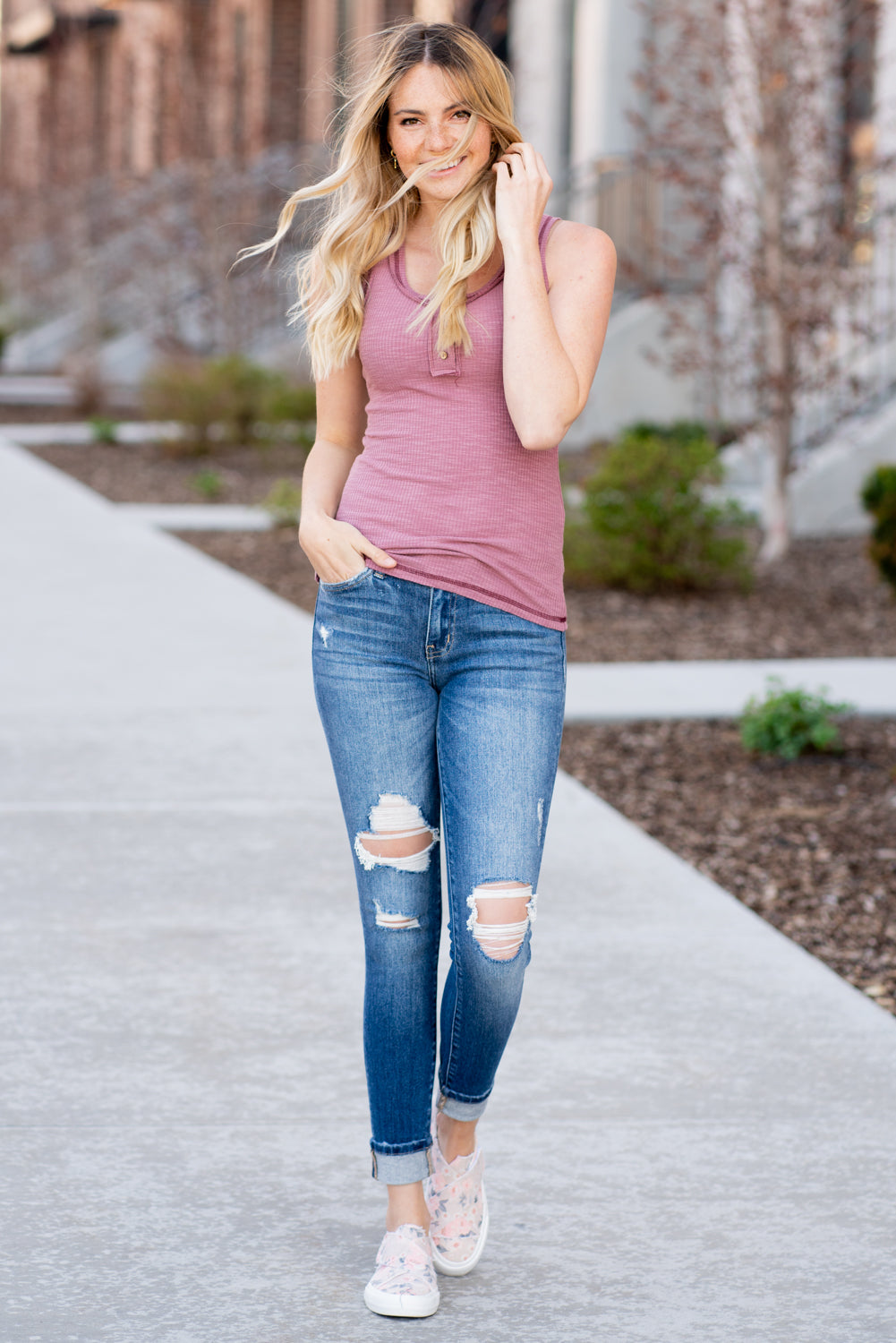 This sleeveless Henley top is great for layering up or down during spring & summer and pairs well with any denim.  Collection: Spring 2021 Color: Berry Button Up Front Henley  Neckline: Round Sleeve: Sleeveless  Material: 60% POLYESTER/32% COTTON/8% SPAN Style #: JAT7478-Berry Contact us if you have any questions about sizing or fit.