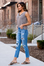KanCan Jeans These 100% cotton mom jeans will become your go to! With no spandex, these jeans will mold to your body shape and feel amazing. Pair with heels or tennies, you cant go wrong with a high rise straight like these. Collection: Spring 2021 Color: Medium Blue Wash Cut: Straight Fit, 27" Inseam  Rise: High-Rise, 11" Front Rise 100% Cotton Fly: Zipper  Style #: KC7859M  Contact us for additional questions about size or fit.