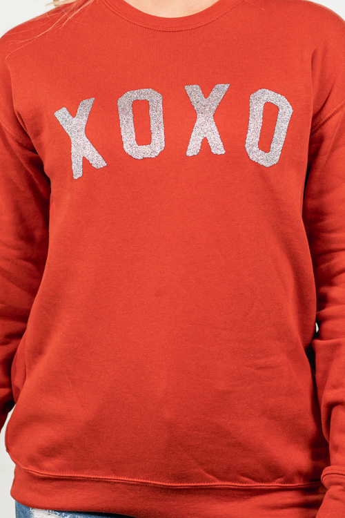 XOXO by Oat Collective   Graphic Fleece Pullover Relaxed Fit Crop   Color: Brick Red Neckline: Round  Sleeve: Raglan Long Sleeve Spun from plush sponge fleece fabric Ribbed Cuffed Wrist Bands Oversized Pull Over Style #: OT2112L685  Contact us for any additional measurements or sizing.      