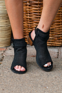 Heeled Sandals by Qupid Style Name: Doria  Color: Black Cut: Strappy Peep Toe with Clasp Back 2" Stacked Heel Material. Outsole: Rubber Upper: Textile/Manmade  Contact us for any additional measurements or sizing.